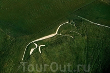 Уффингтонская белая лошадь - 110-метровая меловая фигура на склоне 261-метрового известнякового Холма белой лошади близ местечка Уффингтон в английском ...