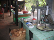 Минифабрика обработки кокосов. Получают стружку, ее варят, есть еще молоко. Скорлупу как дрова используют. в итоге вкусные конфетки.