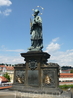 Центральная старейшая скульптура моста. Св. Ян Непомуцкий - небесный покровитель Праги и всей Чехии, католический священник, мученик, по преданию именно ...