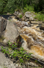 Водопад на реке Койриноя.Ручей Кориноя течет по наклонному желобу в гранитной скале, перегородившей путь воде. В конце желоба поток совершает двухметровый ...